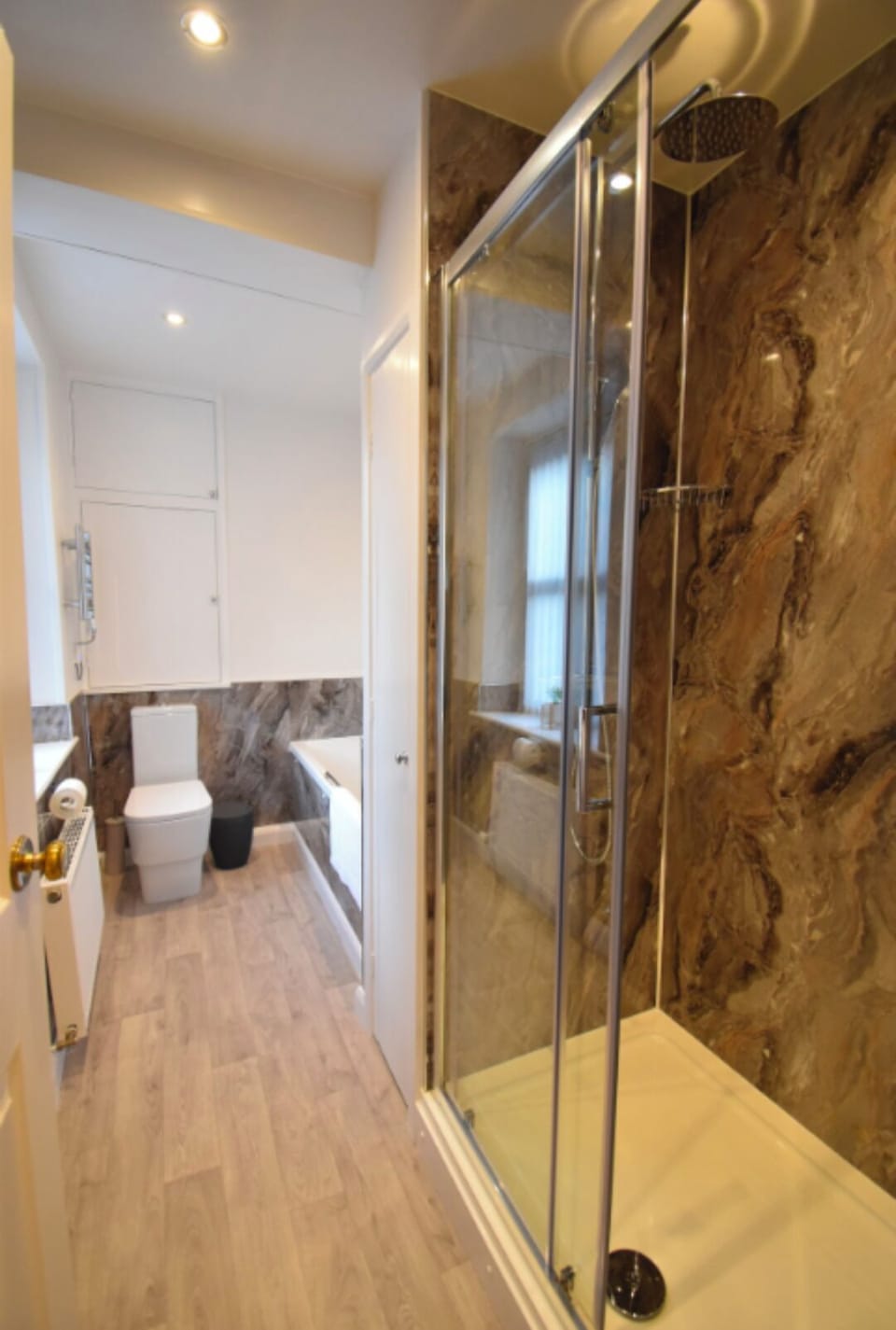 Our wonderful bathroom with bath and large rainfall (plus handheld) shower.