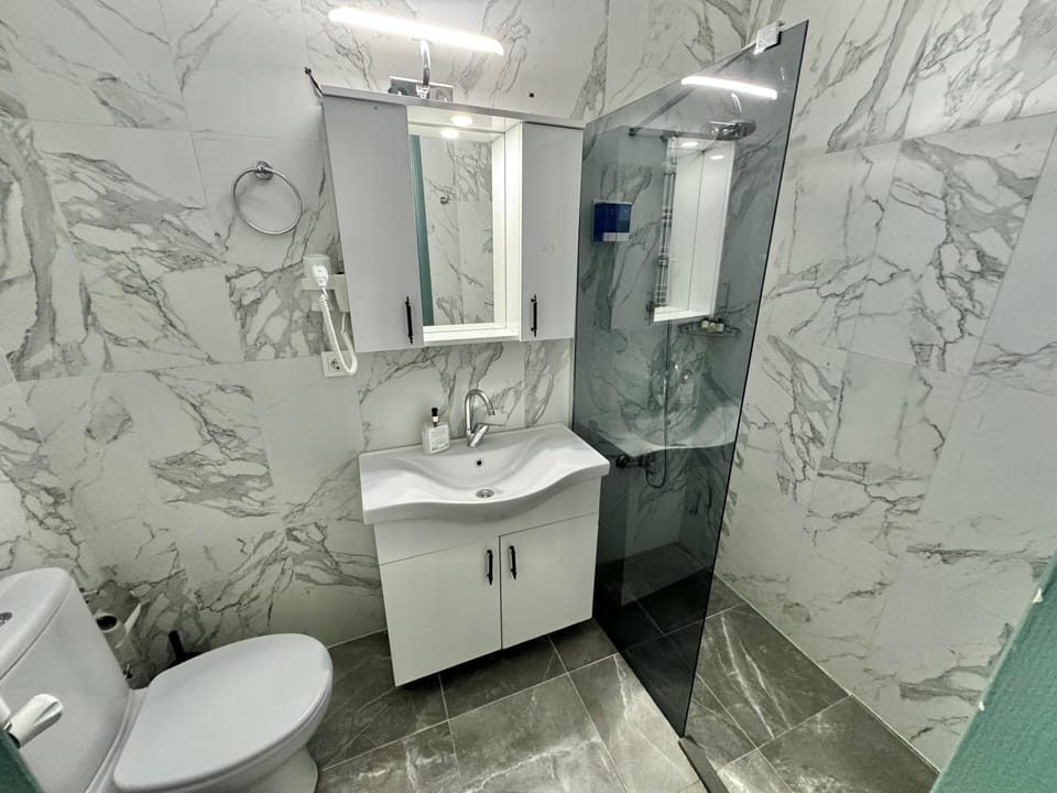 Standard Family Room with Balcony | Bathroom | Shower, rainfall showerhead, hair dryer, bathrobes