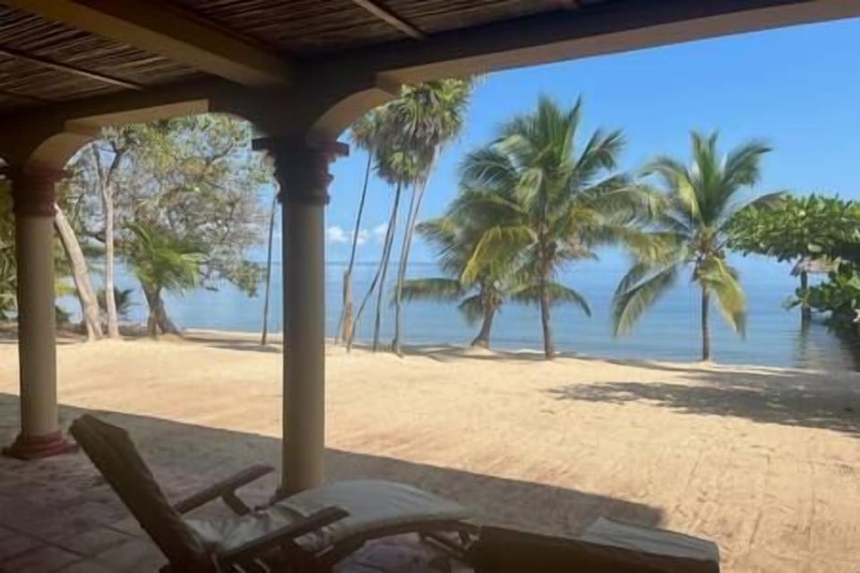 Patio view of the beach and ocean from the lower level suite B 