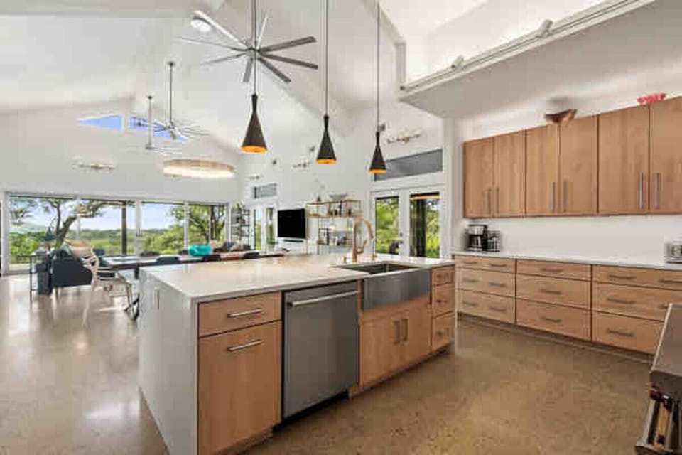 Modern chef’s kitchen with high ceilings and plenty of natural light