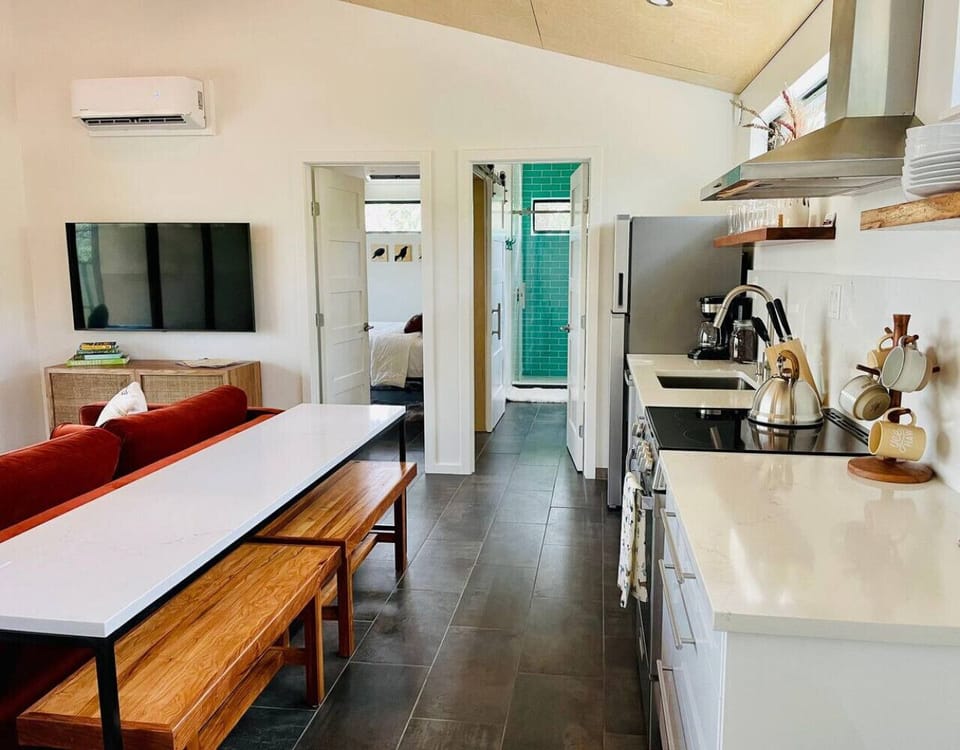 Open kitchen and dining area that flows seamlessly into the living space