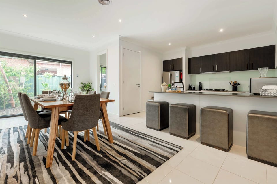 DINING AREA: Impressive in size and style, the open-plan dining area is the perfect place to come together with loved ones. Share a homemade meal, order in, or spend the evening playing board games. There’s plenty of room to relax and connect.