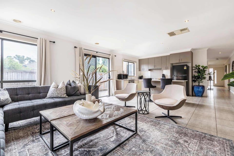 LIVING AREA: Open-plan living with a bright lounge and modern kitchen, designed for comfort and connection