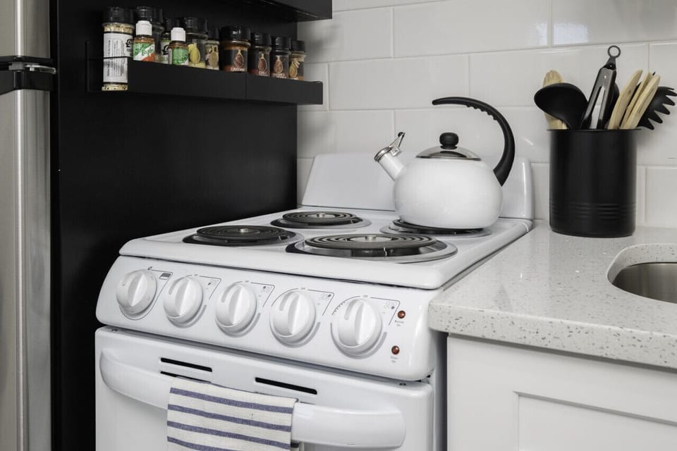 Small space, big convenience! Our modern kitchenette is fully equipped with a microwave, mini-fridge, and all the essential cookware for a quick and easy meal.