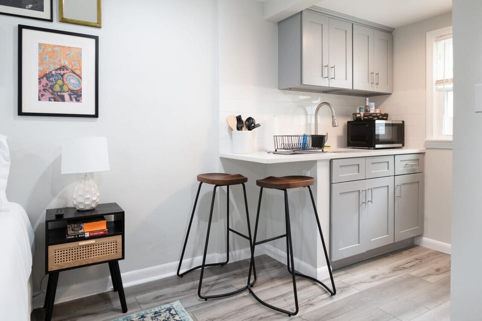 Small space, big convenience! Our modern kitchenette is fully equipped with a microwave, mini-fridge, and all the essential cookware for a quick and easy meal.