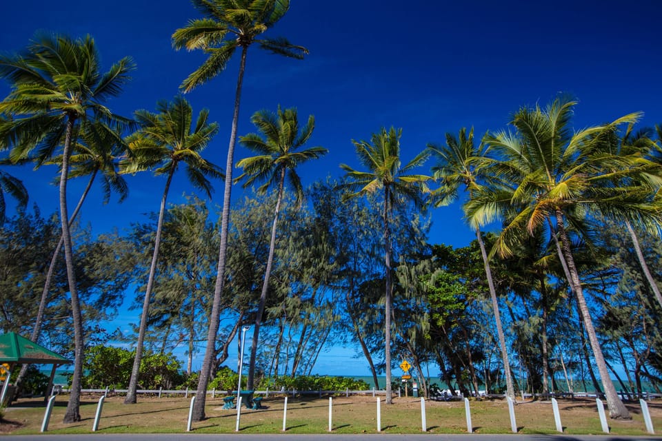 Beach nearby, white sand, beach umbrellas, beach towels