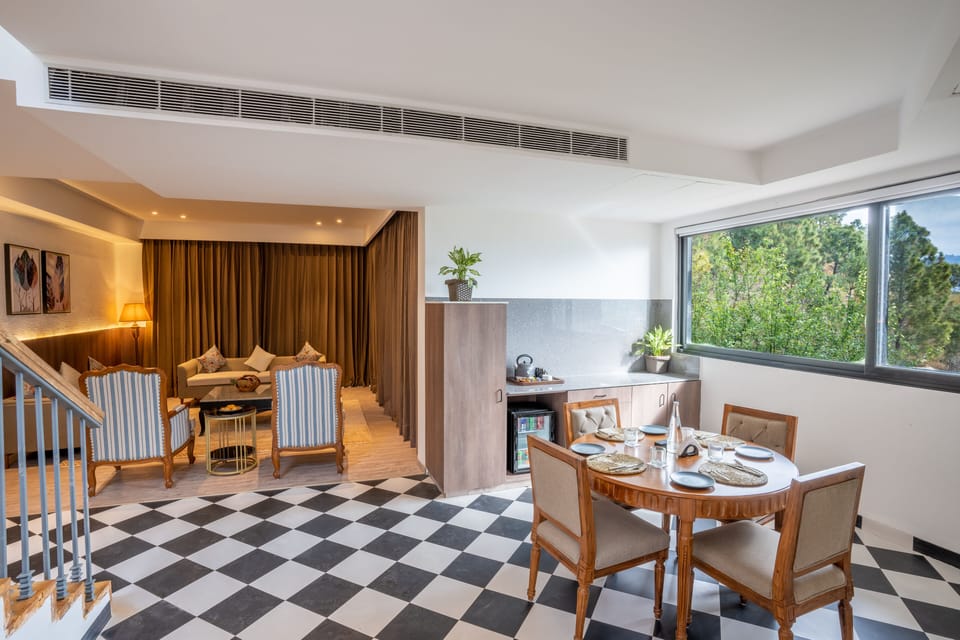 Orchid 3bhk Family Cottage with Balcony | Living area | 52-inch Smart TV with digital channels