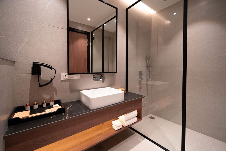 Rosa Room with Balcony | Bathroom | Designer toiletries, hair dryer, slippers, towels