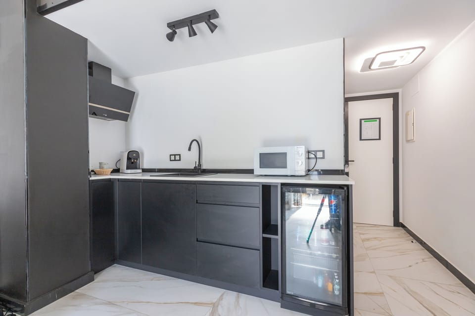 Shared fridge, microwave, espresso maker, coffee/tea maker