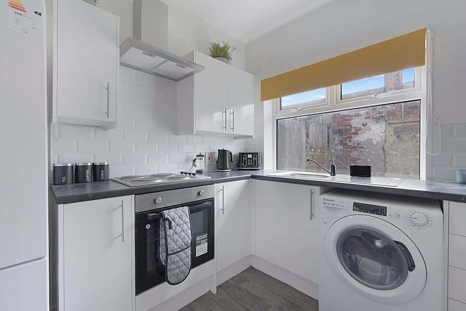 Family-friendly kitchen oasis equipped with all essentials, including a washer & dryer, oven, fridge and full cookware set. 