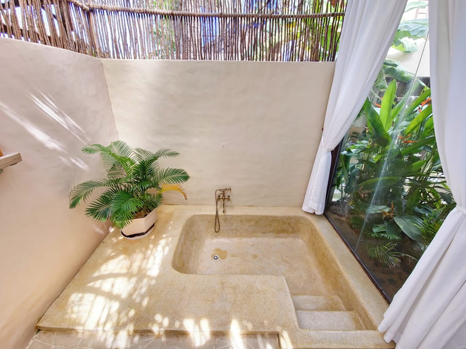 Balcony King Room with Pool View | Bathroom | Bathtub, designer toiletries, hair dryer, slippers
