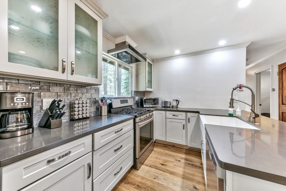 Cook gourmet meals in this fully equipped kitchen with modern appliances, granite countertops, and thoughtful design.