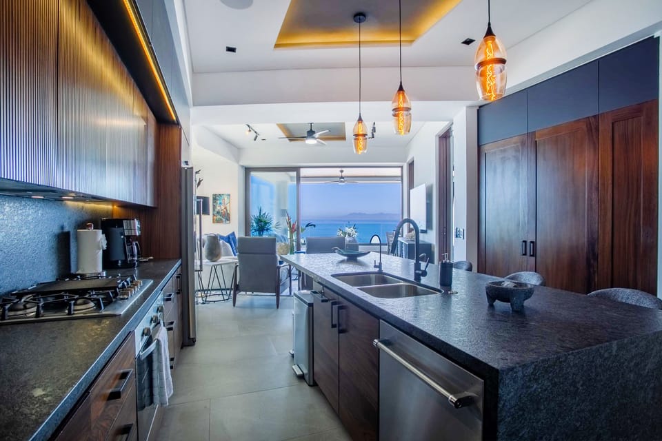The gourmet kitchen is fully equipped with all the essentials for your culinary needs