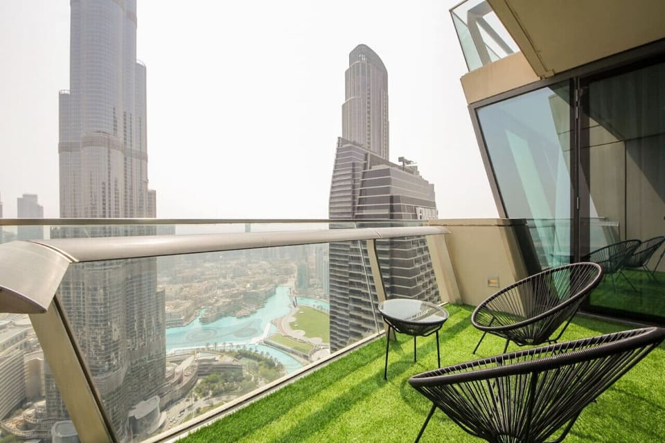 Balcony Retreat: Sip drinks with stunning skyline views and lush urban greenery!