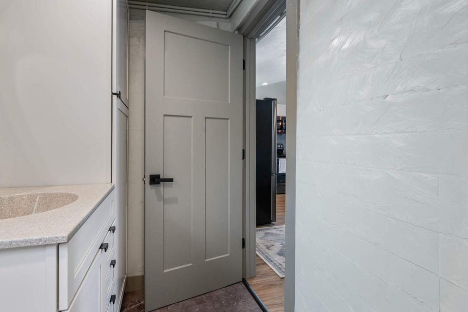 Full size bathroom provides a combination tub and shower