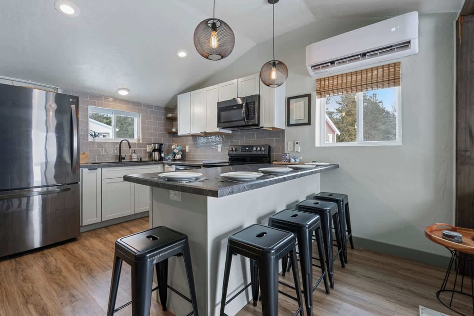 Island with seating for 5, plus 3 extra stools