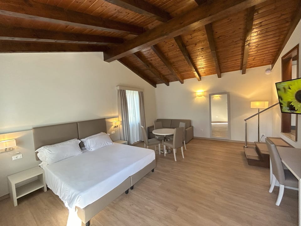 Family Studio, 1 Bedroom, Kitchenette, Tower | Hypo-allergenic bedding, down comforters, minibar, in-room safe
