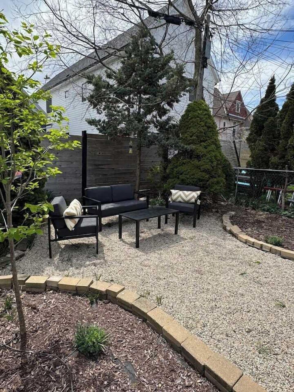 Private backyard patio with outdoor dining for six, perfect for al fresco meals 