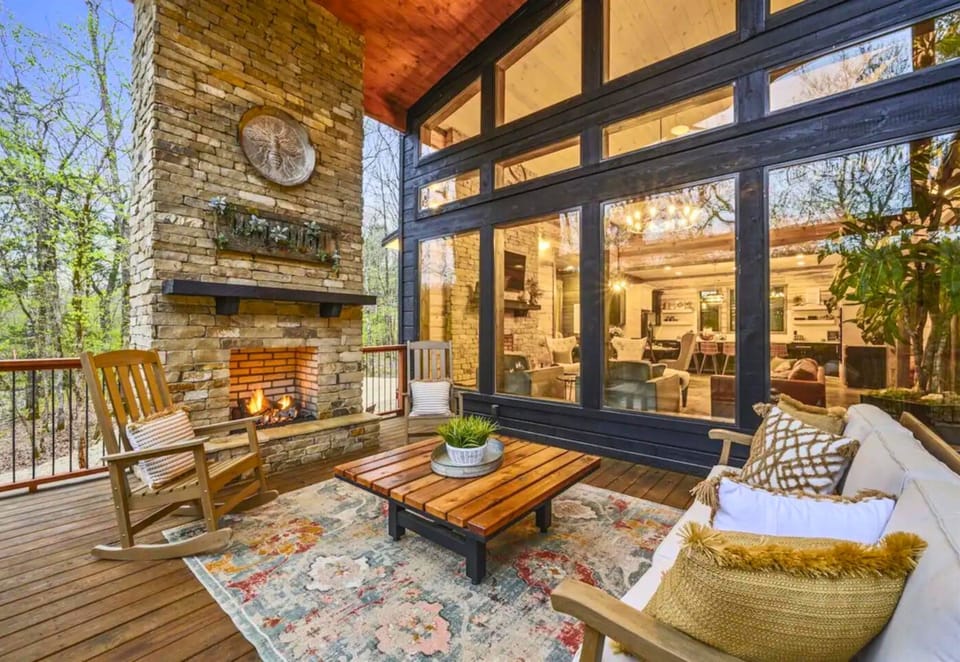 Cozy up fireside on the porch of your dreams. Our lodge blends the comfort of home with the peace of the great outdoors!