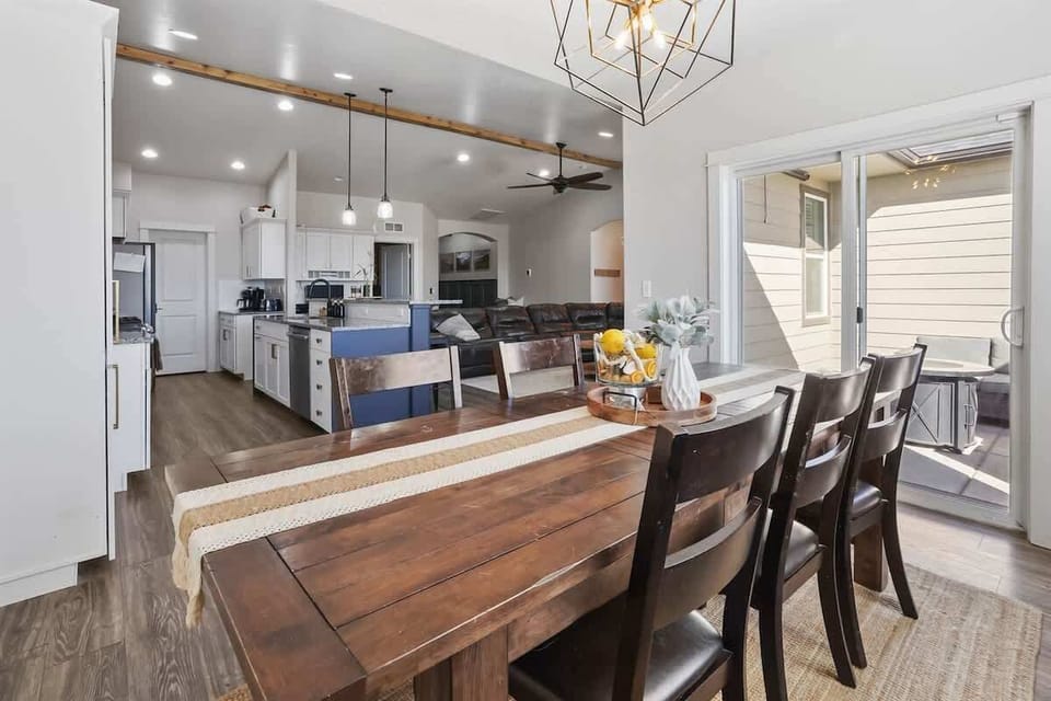 Dining Table, extra folding table and chairs in laundry room