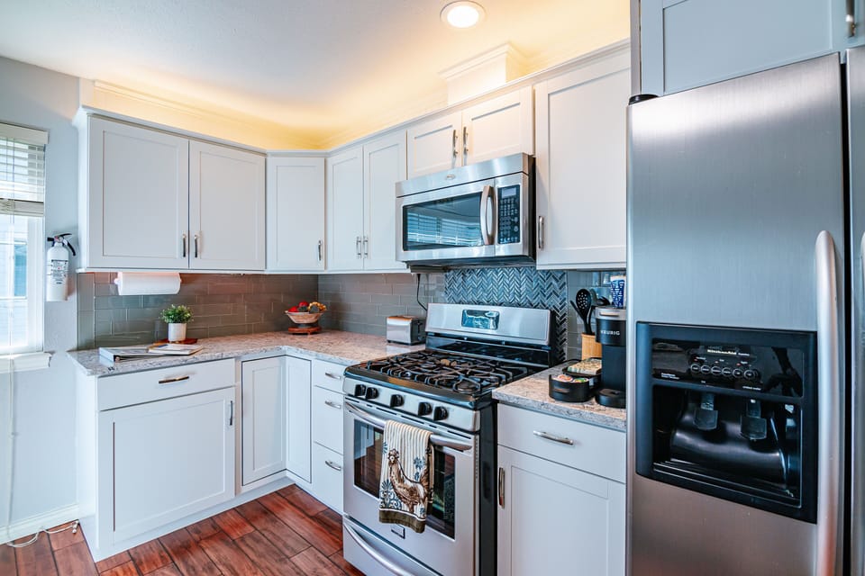 Gas stove, Keurig coffee machine and all the kitchen furnishings you need.