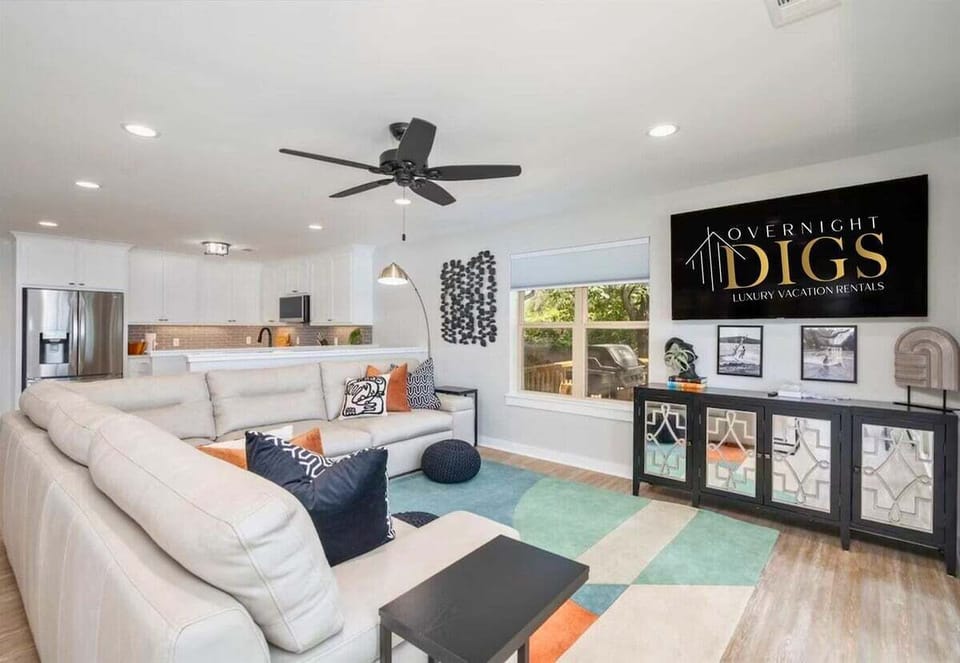 This living room is an ideal spot for family gatherings, movie nights, or simply unwinding after a long day.