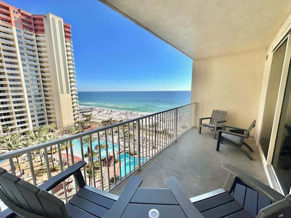 Private 9th-floor balcony with sweeping Gulf and lagoon pool views — perfect for morning coffee and sunset relaxation.