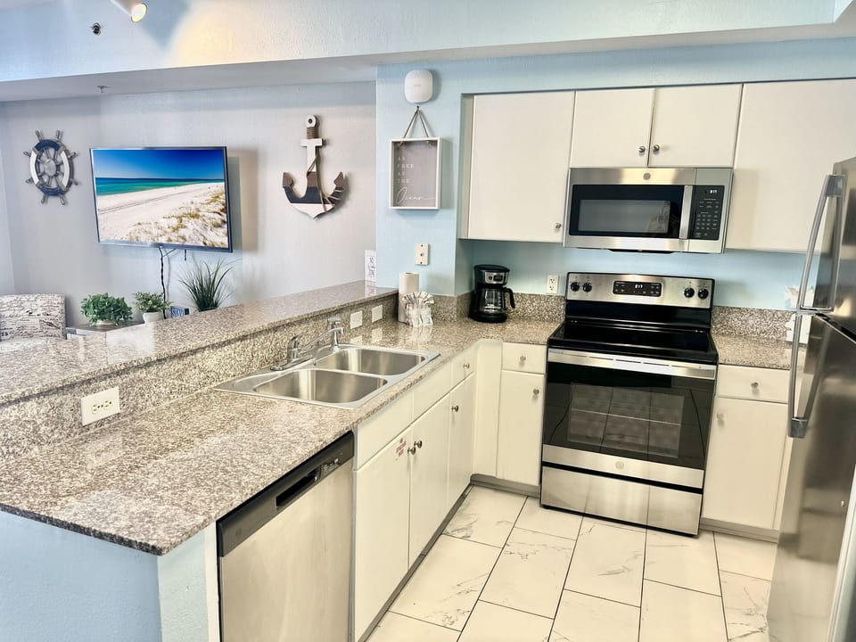 Fully equipped kitchen with everything needed for easy vacation meals and beachside breakfasts.