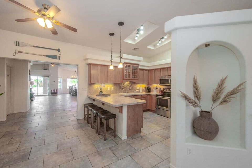 Kitchen Fully Stocked to Serve Large Gatherings (including roasters, crockpot, serving dishes, and full set of pans/dishes).
