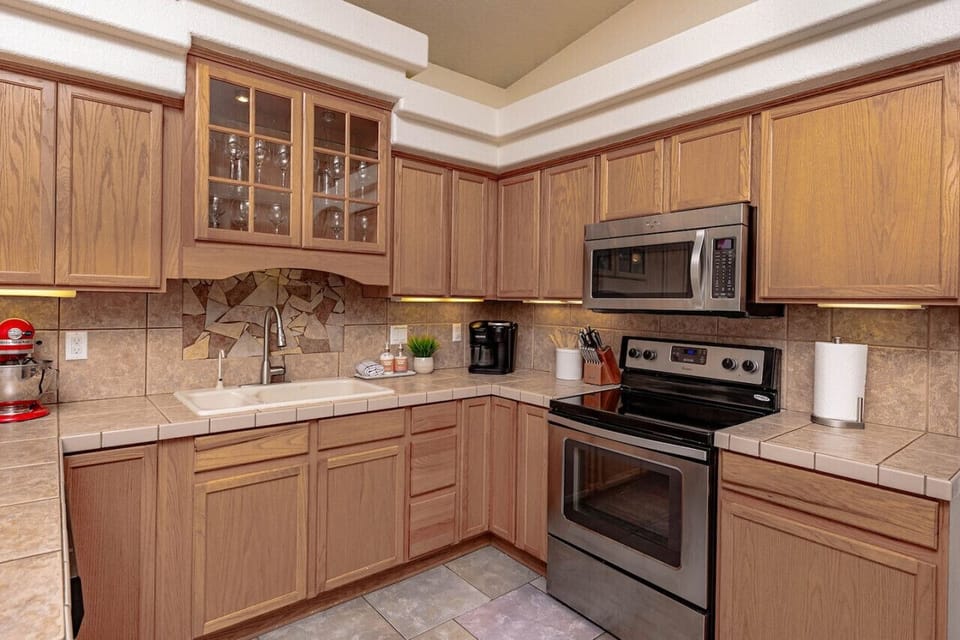 Kitchen Fully Stocked to Serve Large Gatherings (including roasters, crockpot, serving dishes, and full set of pans/dishes).