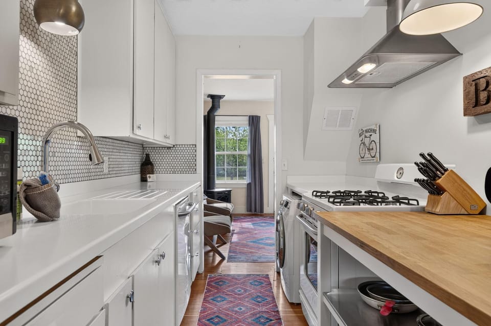 There is an externally vented gas range, dishwasher, microwave and several other small appliances for you to use.