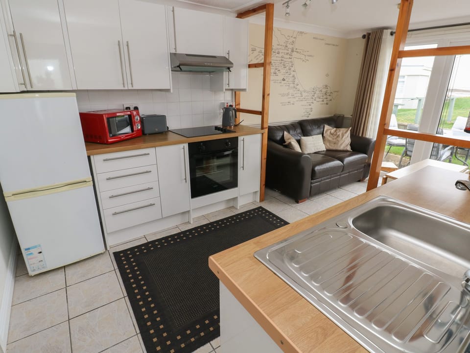 Fridge, electric kettle, cookware/dishes/utensils