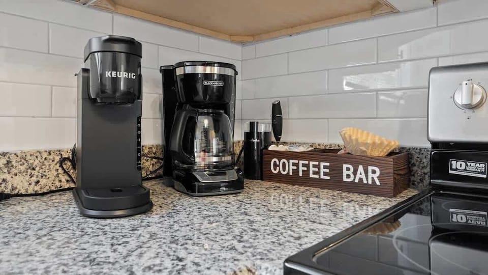 Fully stocked coffee bar with Keurig Machine, Coffee Maker, Coffee Grinder and Frother! 
