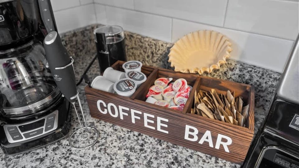 Fully stocked coffee bar with Keurig Machine, Coffee Maker, Coffee Grinder and Frother! 