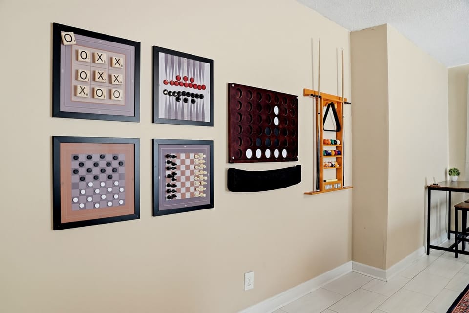 We love how our unique collection of framed vintage backgammon, chess, and checkerboards adds personality to the space, keeping all your classic favorites organized and ready to play.