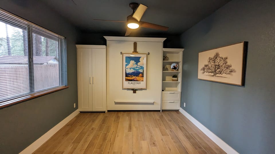 Bedroom 4 with Murphy bed, wardrobe, and drawers