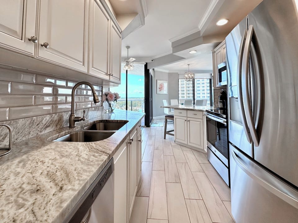 Stainless steel appliance and cabinets galore.