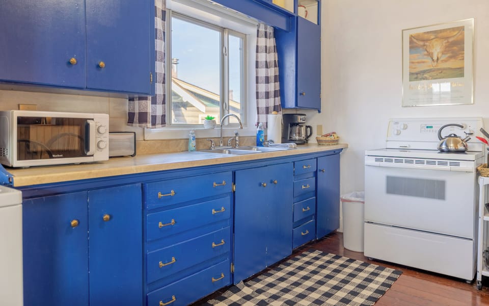 The wonderfully bright eat-in kitchen is well equipped to easily prepare meals