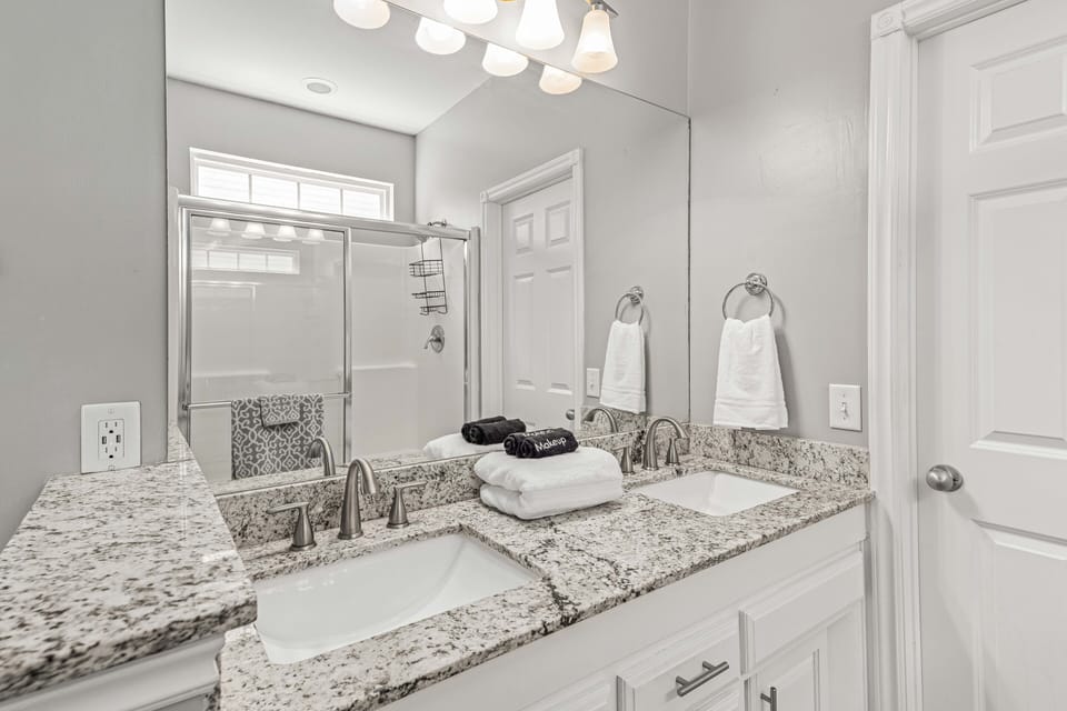 Master bathroom double sinks and large walk in closet.