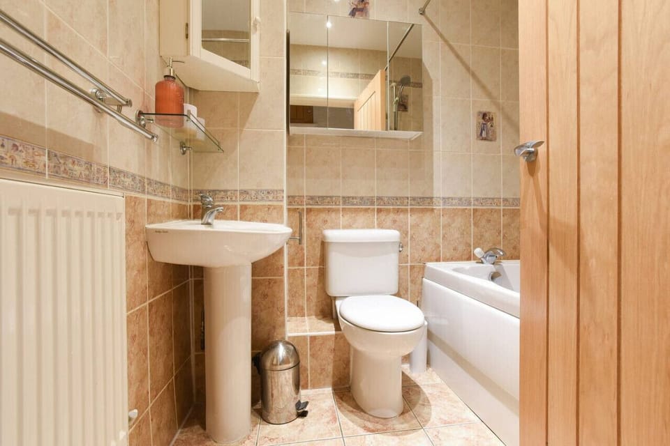 Bathroom with shower over bath