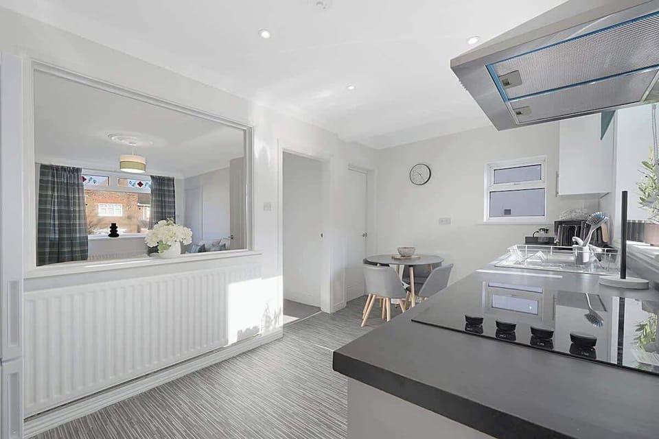 Kitchen equipped with all essentials, including a washer & dryer, oven, fridge and full cookware set.