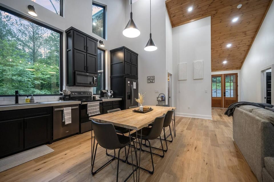 Dining table with pendant lighting overhead