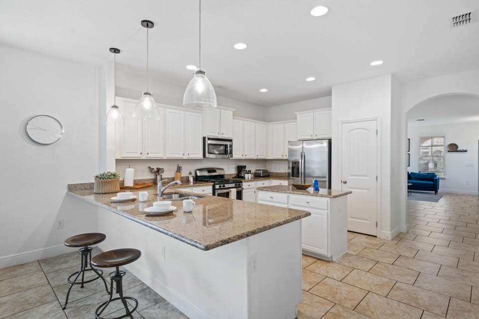 Open-Plan Full equipped kitchen of the home in Davenport - Sufficient storage space - Plenty space to walk and work according to your ease - Availability of all necessary kitchen accessories - Stunningly tiled floor