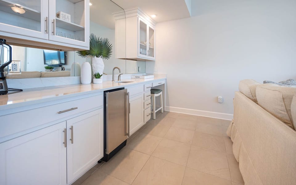 Grab a chilled drink from the fridge or create your favorite cocktail at the wet bar