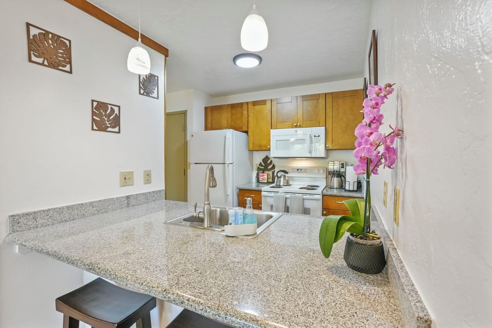 Kitchen area is open to the living area and has ample counter space for creating delicious meals