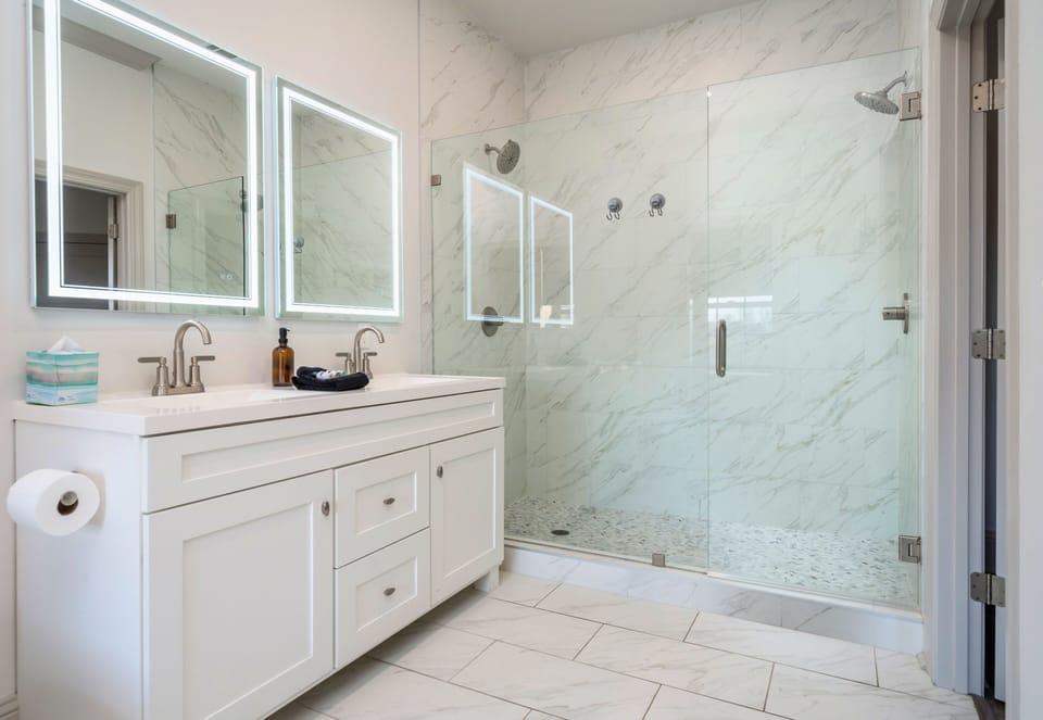 [Ensuite Bathroom] The Ensuite Bathroom Features a Double sink Vanity and His and Hers Double Shower!