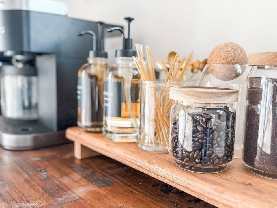 Grind and shine!  Our coffee station is complete with ground coffee, k-cups, espresso beans, coffee grinder, liquid creamer, hot chocolate,  tea, honey sticks and an assortment of specialty syrups.  We love you a Latte!