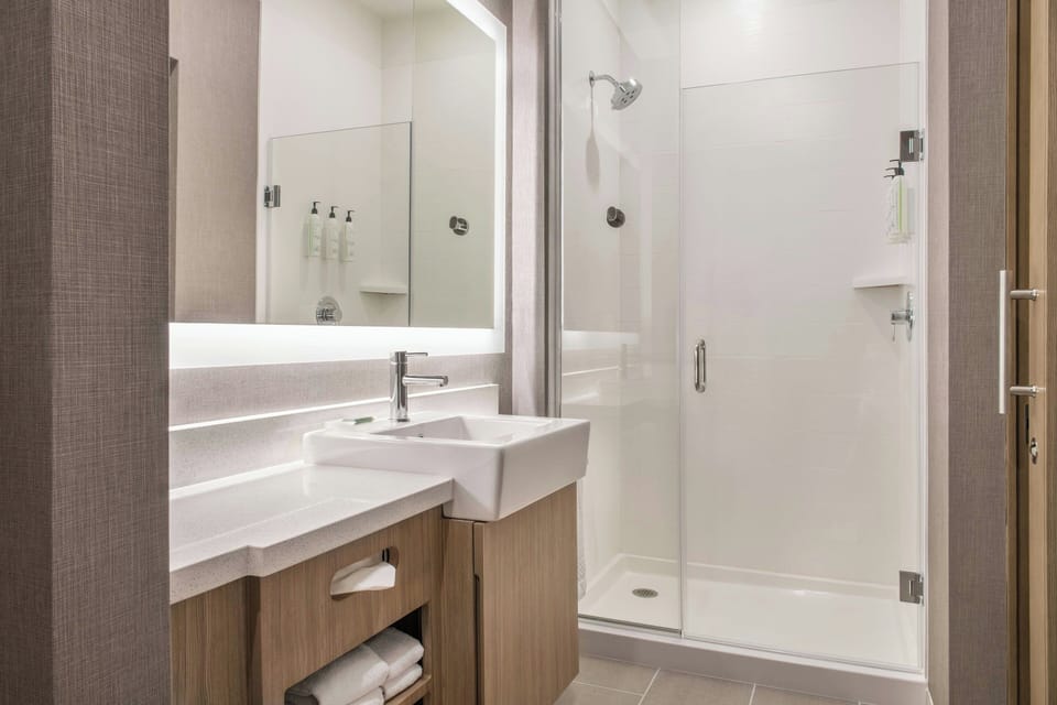 Shower, rainfall showerhead, towels, soap