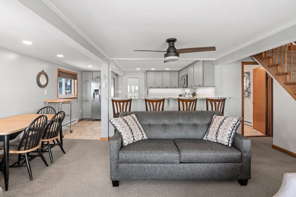 Sleeper sofa on first floor with first floor bathroom in the background