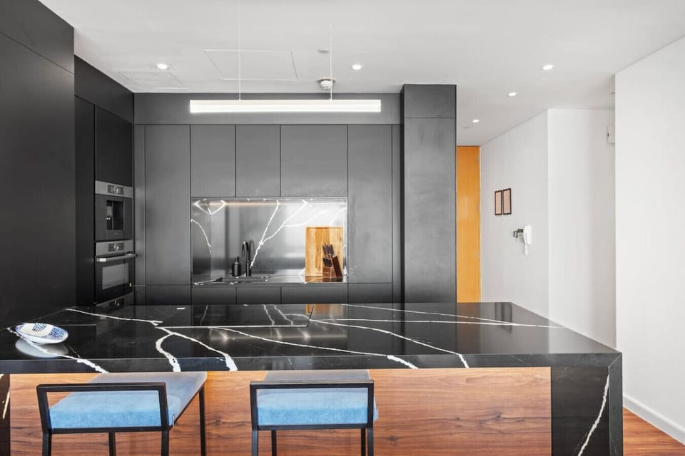 Stylish Kitchen: Cook gourmet meals in a sleek space with stunning marble accents and modern amenities!